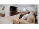 Finished basement with sectional sofa, large TV, and exercise equipment at 12451 Turquoise Terrace Pl, Castle Pines, CO 80108