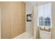Updated bathroom with a built-in niche, a shower-tub combination, and bright natural light at 12451 Turquoise Terrace Pl, Castle Pines, CO 80108