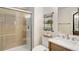 Modern bathroom featuring a glass-enclosed shower and marble countertop at 12451 Turquoise Terrace Pl, Castle Pines, CO 80108