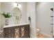 Contemporary half bath boasts a stylish vanity, quartz countertops, and decorative mirror at 12451 Turquoise Terrace Pl, Castle Pines, CO 80108