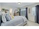 Calming bedroom with a bed, large window, and a dresser with a mirror at 12451 Turquoise Terrace Pl, Castle Pines, CO 80108