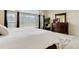 Light-filled bedroom with large window, curtains, and a decorative wood dresser at 12451 Turquoise Terrace Pl, Castle Pines, CO 80108