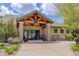 Clubhouse with a decorative wood and stone facade at 12451 Turquoise Terrace Pl, Castle Pines, CO 80108