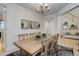 Bright dining room featuring a wooden table set and stylish decor at 12451 Turquoise Terrace Pl, Castle Pines, CO 80108
