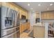 Spacious kitchen featuring stainless steel appliances, light wood cabinetry, and plenty of counter space at 12451 Turquoise Terrace Pl, Castle Pines, CO 80108
