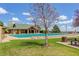 Community pool featuring covered seating, lounge chairs, and manicured green space on a bright and sunny day at 12451 Turquoise Terrace Pl, Castle Pines, CO 80108