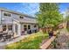 Spacious backyard featuring a patio, well-maintained lawn, and mature trees at 6110 Raleigh Cir, Castle Rock, CO 80104