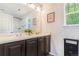 This bathroom features a double sink vanity and decorative framed print at 6110 Raleigh Cir, Castle Rock, CO 80104