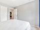 A bright bedroom with white walls, a double door closet, and a door leading to another room at 6110 Raleigh Cir, Castle Rock, CO 80104