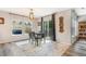 Open dining area with a modern table set, natural light, and hardwood floors at 6110 Raleigh Cir, Castle Rock, CO 80104
