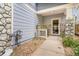Charming front porch area with stone accents and space for outdoor seating at 6110 Raleigh Cir, Castle Rock, CO 80104