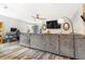 Cozy living room with a large gray sofa and hardwood floors at 6110 Raleigh Cir, Castle Rock, CO 80104