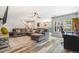 Spacious living room with a large gray sectional sofa and hardwood floors at 6110 Raleigh Cir, Castle Rock, CO 80104