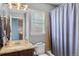 Bathroom features a vanity with granite counters, and a bathtub with shower, providing a practical and stylish space at 20466 Willowbend Ln, Parker, CO 80138