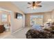 Spacious bedroom featuring a large window, television, and ensuite bathroom with coordinated design at 20466 Willowbend Ln, Parker, CO 80138