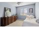 Charming bedroom with ample natural light, complemented by a large dresser and cozy decor at 20466 Willowbend Ln, Parker, CO 80138