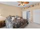 Comfortable bedroom with a ceiling fan, neutral colors, and closet, creating a cozy and inviting space at 20466 Willowbend Ln, Parker, CO 80138