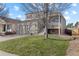 Inviting two-story home with a well-kept lawn, and a covered front porch in a suburban neighborhood at 20466 Willowbend Ln, Parker, CO 80138