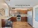 Spacious kitchen with stainless steel appliances, granite countertops, and wood flooring for a modern look at 20466 Willowbend Ln, Parker, CO 80138