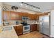 Modern kitchen with stainless steel appliances, granite countertops, and ample cabinet space for storage at 20466 Willowbend Ln, Parker, CO 80138