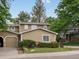 Home featuring well-maintained landscaping, an attached garage, and a classic design, perfect for suburban living at 12599 Elm St, Thornton, CO 80241