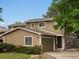 Charming two-story home with attached garage, tidy front yard, and manicured shrubs at 12599 Elm St, Thornton, CO 80241