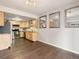 Kitchen featuring light-colored cabinets, stainless steel appliances, granite countertops, and hardwood floors at 12599 Elm St, Thornton, CO 80241