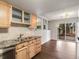 Cozy kitchen with wood cabinets and plenty of natural light overlooking the backyard at 12599 Elm St, Thornton, CO 80241