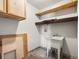 The laundry room has a utility sink and storage shelves at 12599 Elm St, Thornton, CO 80241