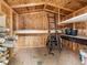 Inside a wood frame shed with shelving and storage space for organization and tools at 12599 Elm St, Thornton, CO 80241