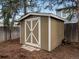 Exterior shot of an outdoor storage shed with double doors and pine needle ground cover at 12599 Elm St, Thornton, CO 80241
