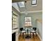 Charming breakfast nook featuring skylights, multiple windows and modern decor at 1315 Grape St, Denver, CO 80220