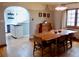 Dining room with hardwood floors, access to modern kitchen and lots of natural light at 1315 Grape St, Denver, CO 80220