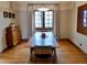 Bright dining room features hardwood floors, large windows and modern lighting fixture at 1315 Grape St, Denver, CO 80220