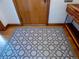Hallway showing decorative tiled flooring leading into other rooms at 1315 Grape St, Denver, CO 80220
