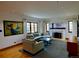 Spacious living room with a fireplace, ample seating, and natural light at 1315 Grape St, Denver, CO 80220