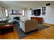 Living room featuring a cozy seating area, fireplace, and hardwood floors at 1315 Grape St, Denver, CO 80220