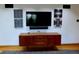 Modern entertainment area showcasing a TV, storage console, and contemporary artwork at 1315 Grape St, Denver, CO 80220