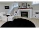 Finished basement features a fireplace, plush seating, built in shelving and carpet floors at 1315 Grape St, Denver, CO 80220