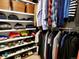 Well-organized walk-in closet with shelves, hanging rods, and storage baskets for clothing and shoes at 1315 Grape St, Denver, CO 80220
