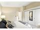 Relaxing bedroom with a sliding closet, carpeted floor, soft lighting, and neutral decor at 1978 Newland Ct, Lakewood, CO 80214