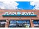 Exterior view of Playa Bowls with prominent signage, brick facade, and storefront windows at 1978 Newland Ct, Lakewood, CO 80214