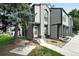 Charming home boasts well-maintained landscaping, gray siding and a private front porch at 1978 Newland Ct, Lakewood, CO 80214