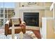 Living room has a fireplace with stone surround and wood flooring, plus outdoor access at 1978 Newland Ct, Lakewood, CO 80214