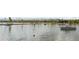 Beautiful view of boats on the lake with mountains and buildings in the distance at 1978 Newland Ct, Lakewood, CO 80214