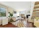 Cozy living room features a fireplace, sliding doors, and an adjacent staircase at 1978 Newland Ct, Lakewood, CO 80214