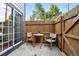 Private patio with a wooden fence, perfect for outdoor dining and relaxation at 1978 Newland Ct, Lakewood, CO 80214