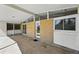 Back patio area with brick siding and large windows overlooking the backyard at 1573 S Dexter Way, Denver, CO 80222