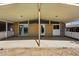 Spacious covered patio featuring brick siding and views of the home's backyard at 1573 S Dexter Way, Denver, CO 80222