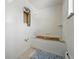 Unfinished bathroom featuring tile flooring and an unfinished tub space at 1573 S Dexter Way, Denver, CO 80222